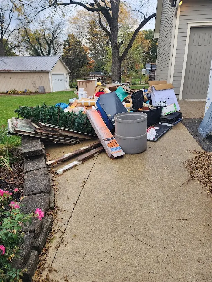 Dumpster being loaded with debris for 30 Yard Dumpster Rental in Lower Frederick